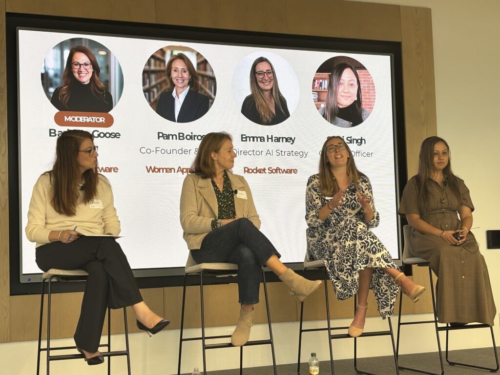 Barbara Goose, Pam Boiros, Emma Harney, and Sumi Singh on stage during the Boston AI Week panel at Rocket Software